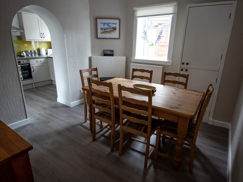 A dining room with a table and chairs at The Old Barn in Manchester
