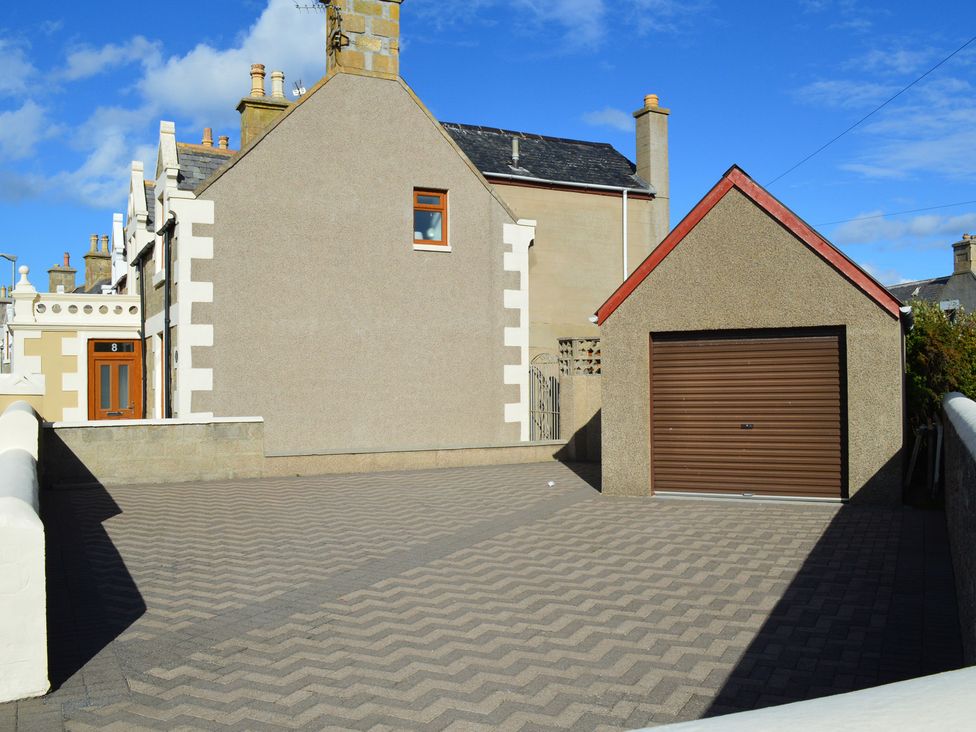A house and garage in an outdoor area at The Old Barn in Manchester