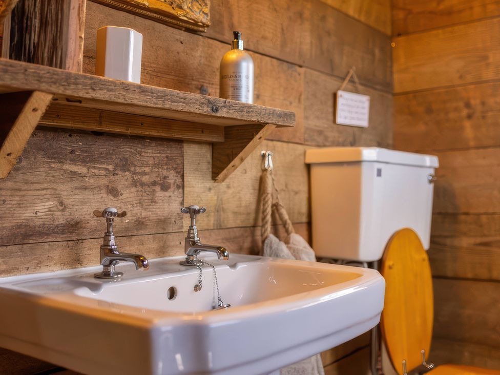 A bathroom with a sink and toilet at The Old Barn in Manchester
