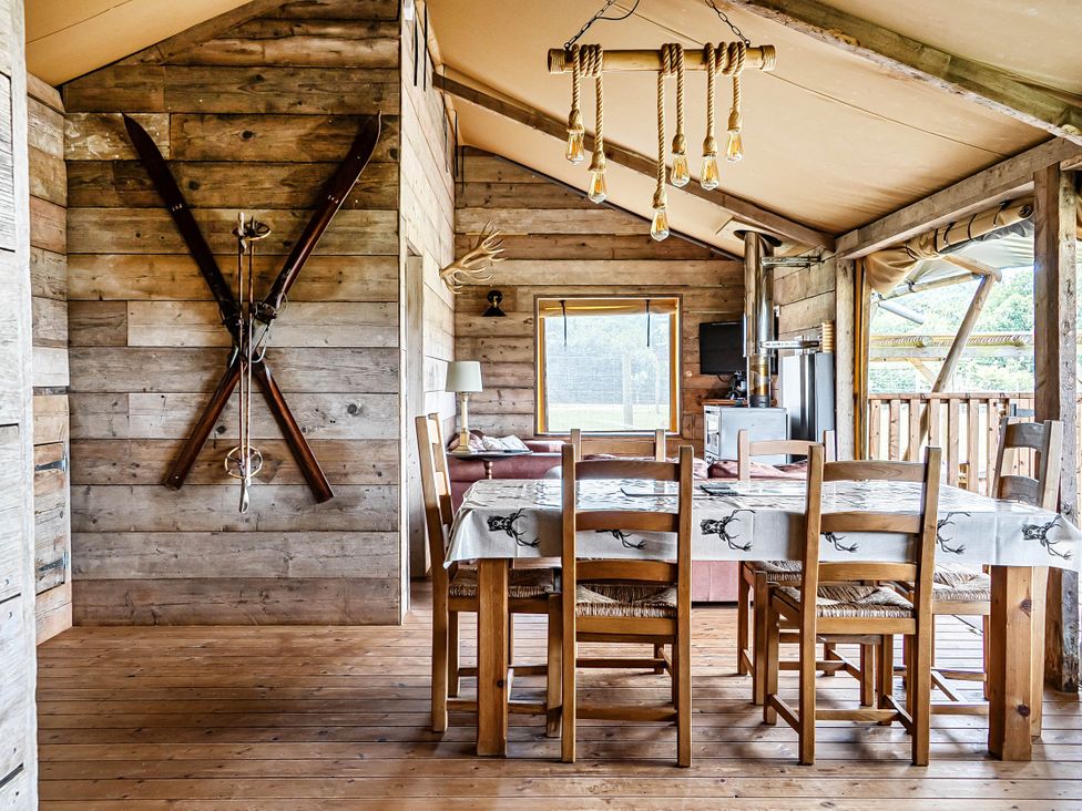 A dining room with a table and chairs at Luxury Safari Lodge Sleeps 4/6 Deer Park Dogs Ok Zeal Monachorum near Bow