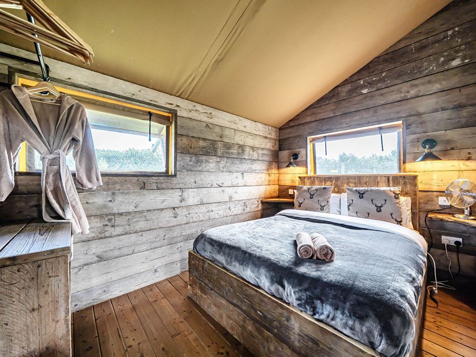 A bedroom with a bed and wooden furniture at Luxury Safari Lodge Sleeps 4/6 Deer Park Dogs Ok Zeal Monachorum near Bow