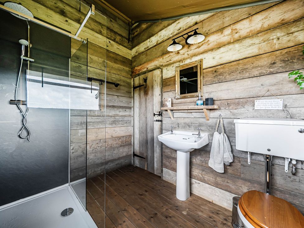 A bathroom with a shower, sink, and toilet at Luxury Safari Lodge Sleeps 4/6 Deer Park Dogs Ok Zeal Monachorum near Bow