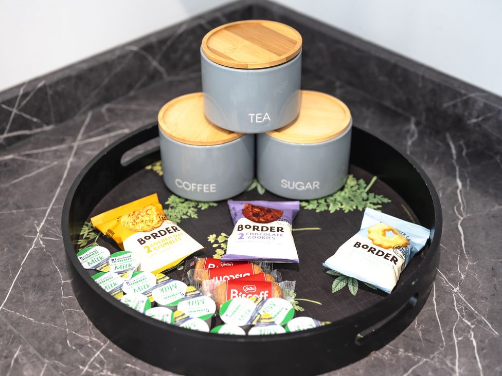 A kitchen tray with canisters and snacks at the property