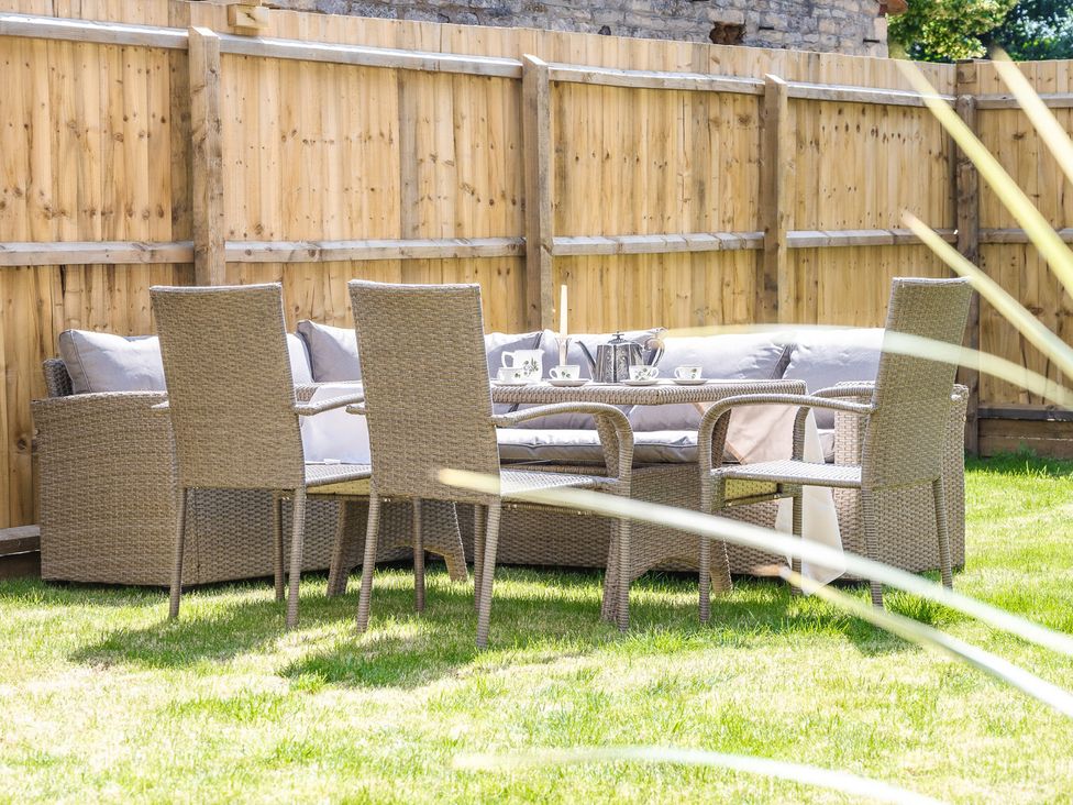 A garden with seating and table at 