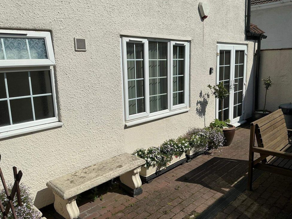 An outdoor area with benches and plants at the property in unknown location