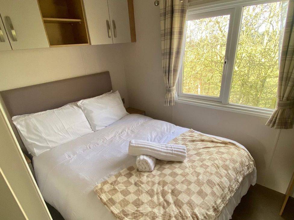 A bedroom with a double bed and window at the property