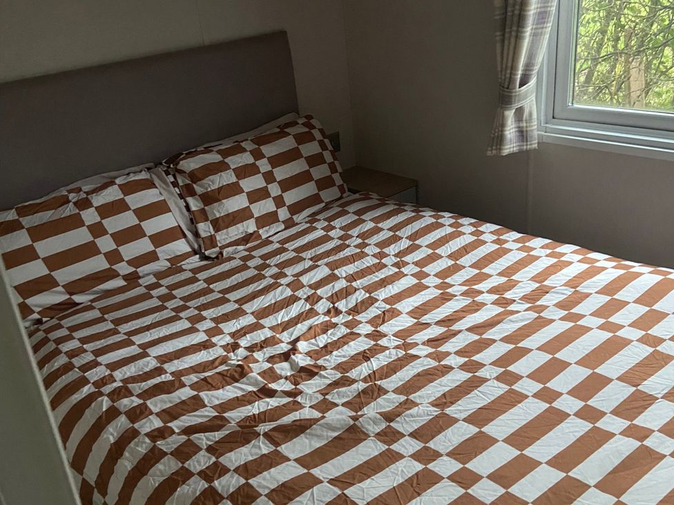 A bedroom with a bed and window at 