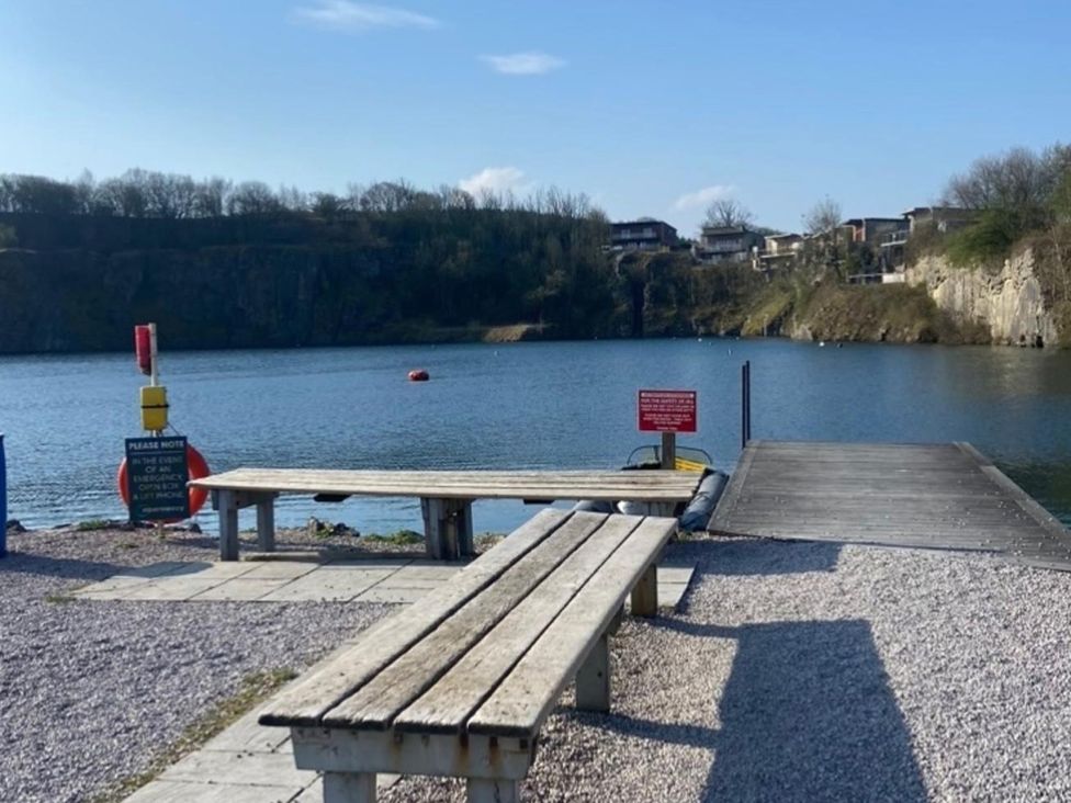 A pier with benches and a water view at a quarry site