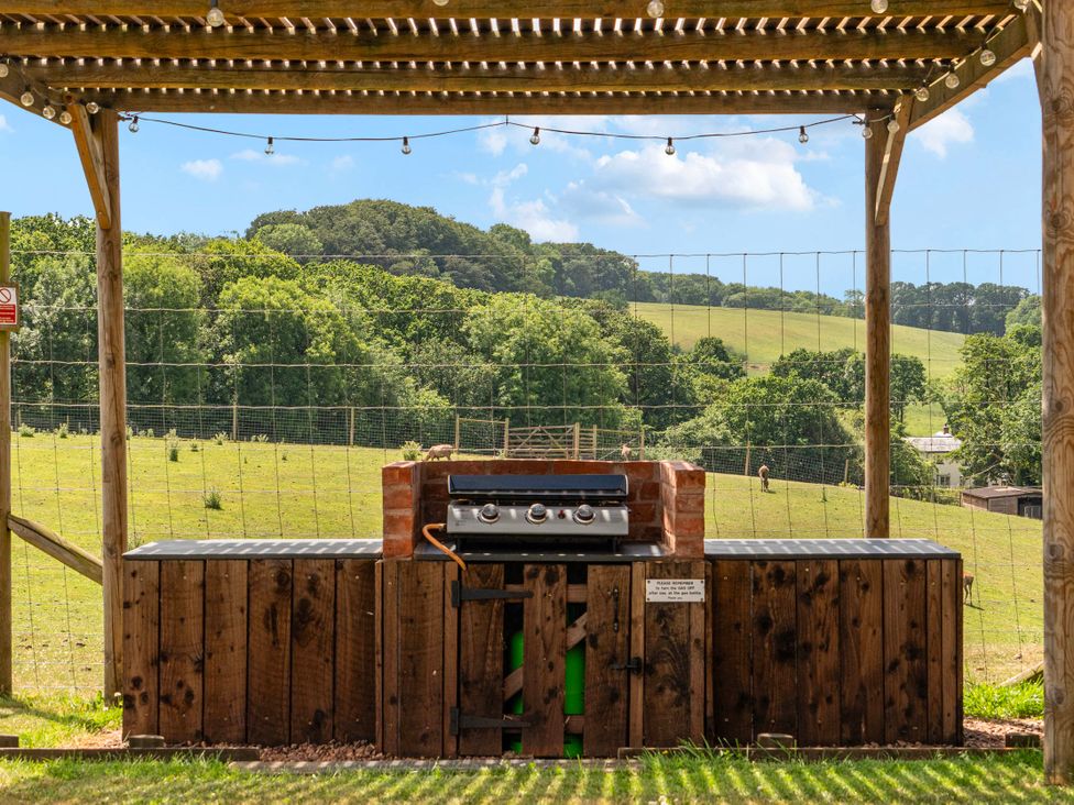 An outdoor grill in a wooden structure at Luxury Safari Lodge Sleeps 4/6 Deer Park Dogs Ok Zeal Monachorum near Bow