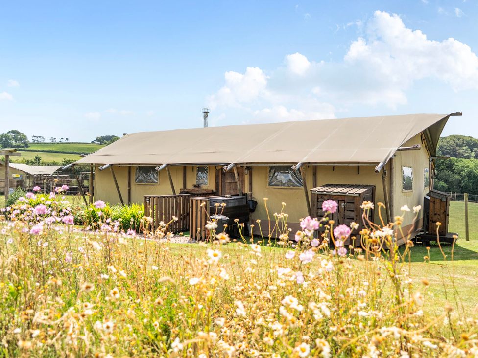 A tent with a deck and grill at Luxury Safari Lodge Sleeps 4/6 Deer Park Dogs Ok Zeal Monachorum near Bow