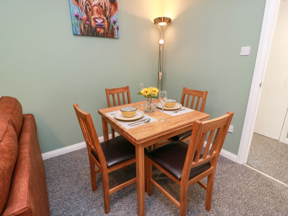 A dining room with a table and chairs at No.31 Craigard Road 