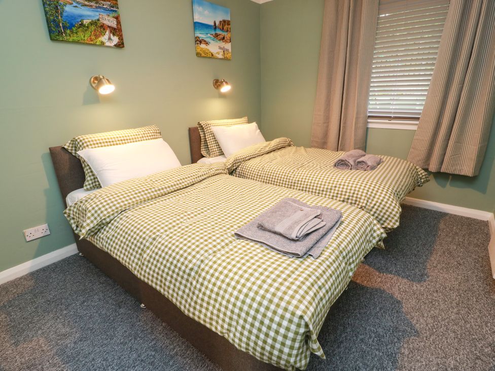 A bedroom with two single beds at No.31 Craigard Road