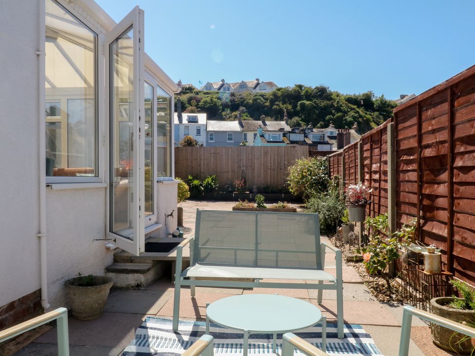 A garden with a seating area at 3 Heath Park in Brixham