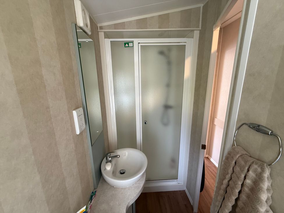 A bathroom featuring a sink and shower at Haggerston Castle Lakeside East 76 Berwick-upon-Tweed