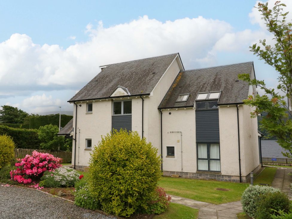 A house with flowers and pathway at Craigard in Aberfeldy