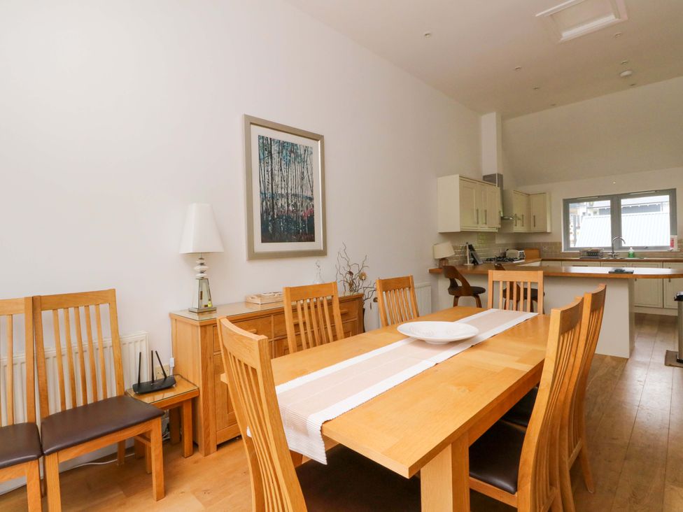 A dining room with a table and chairs at Craigard in Aberfeldy