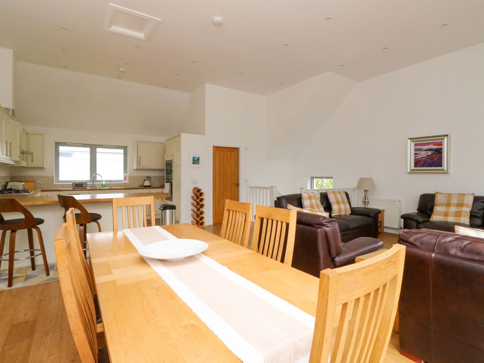 A dining room with table and chairs at Craigard in Aberfeldy