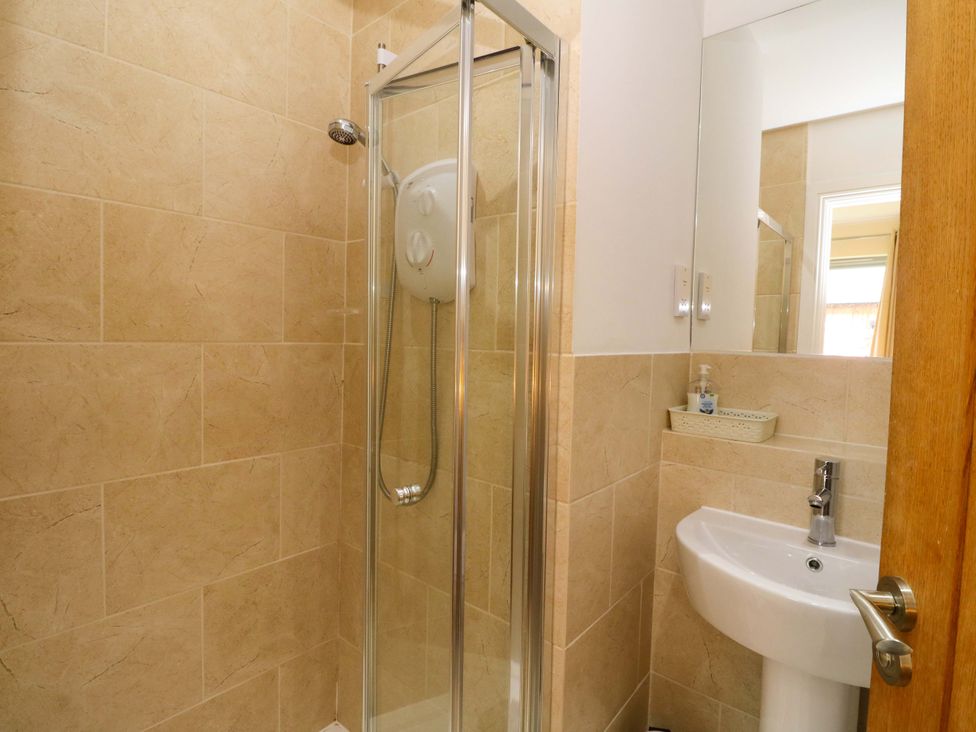 A bathroom with a shower and sink at Craigard in Aberfeldy