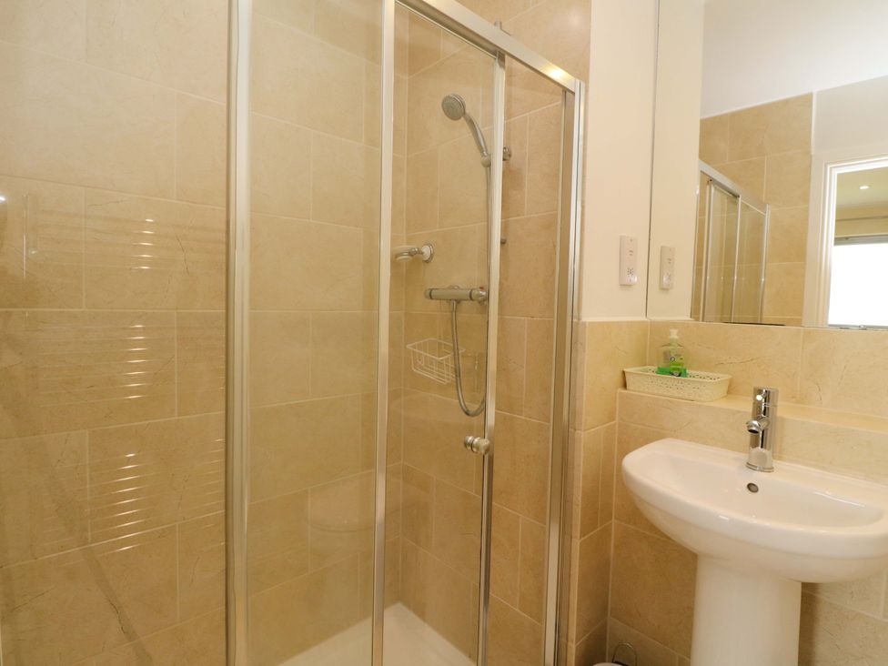 A bathroom with shower and sink at Craigard Aberfeldy