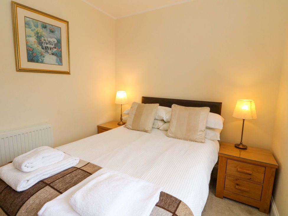 A bedroom with a double bed and bedside tables at Craigard in Aberfeldy