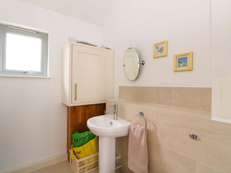 A bathroom with a sink and a mirror at Craigard in Aberfeldy