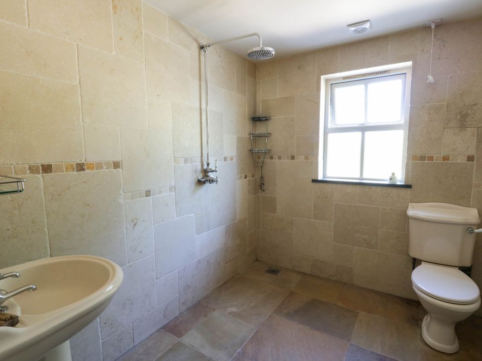 A bathroom with a shower and sink at Yr Hen Felin Boncath