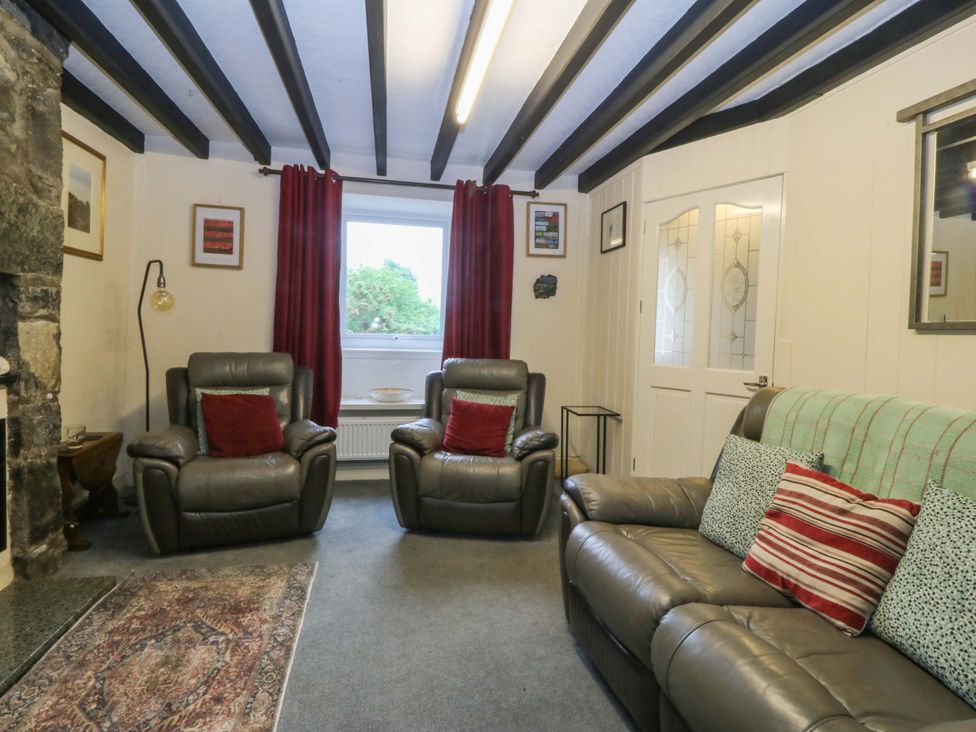 A living room with two armchairs and a sofa at Tyr Felin in Caernarfon