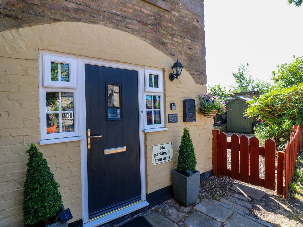 An entrance with door and shrubs at Arch Mews Cottage Middleton-In-Teesdale