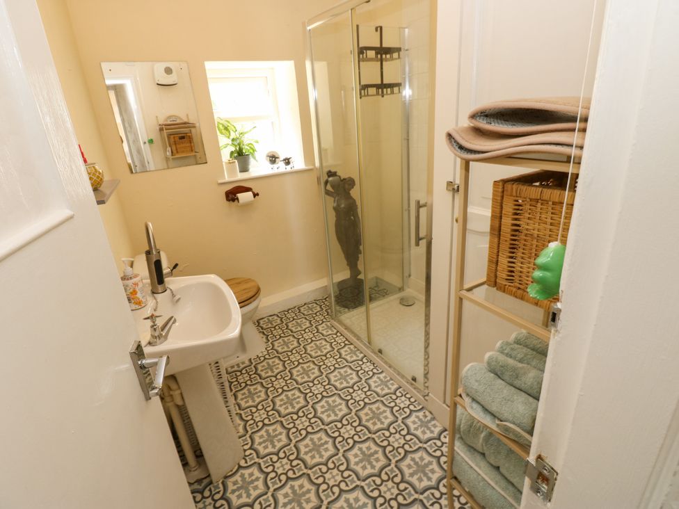A bathroom with a shower and sink at Arch Mews Cottage Middleton-In-Teesdale