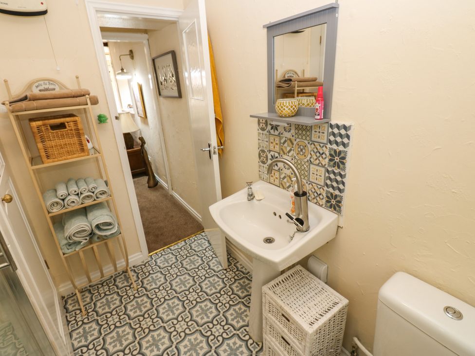 A bathroom with a sink and toilet at Arch Mews Cottage, Middleton-In-Teesdale