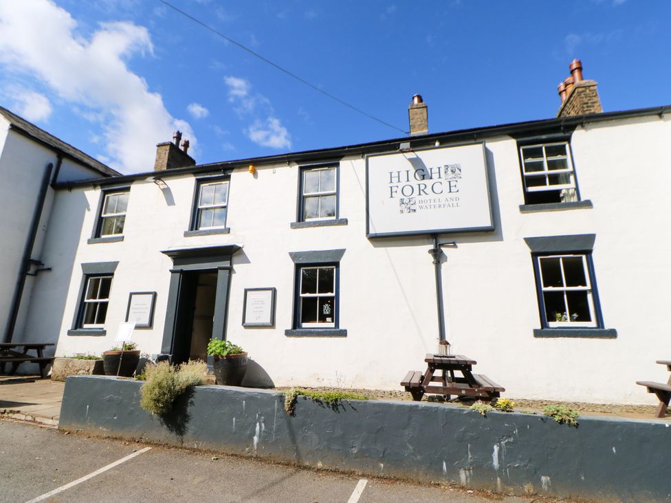 An exterior view of a building with a sign at High Force Hotel and Waterfall in Middleton-In-Teesdale