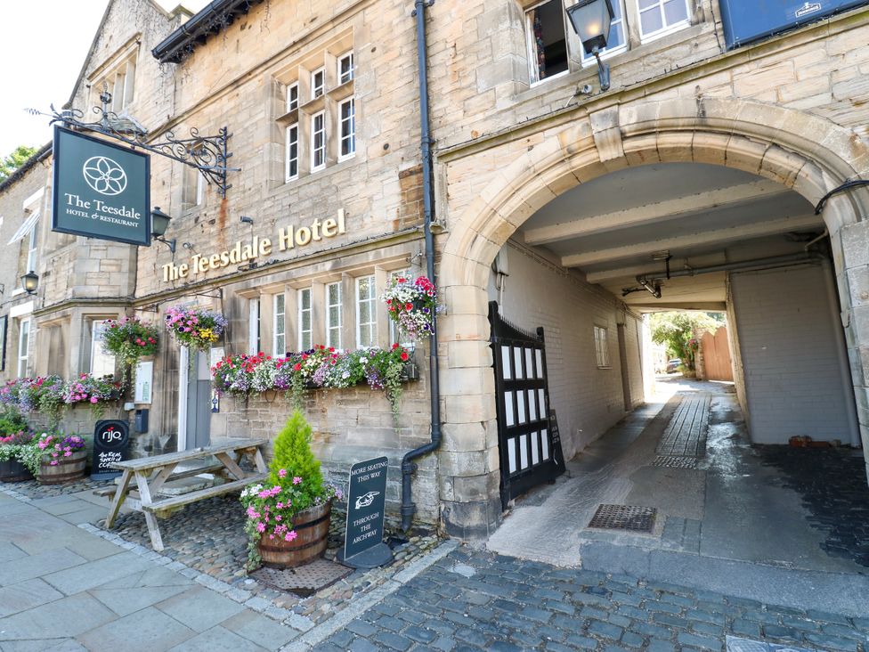 An outdoor view of The Teesdale Hotel with flowers at Middleton-In-Teesdale