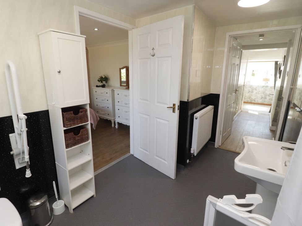 A bathroom with a toilet and sink at Farm Cottage