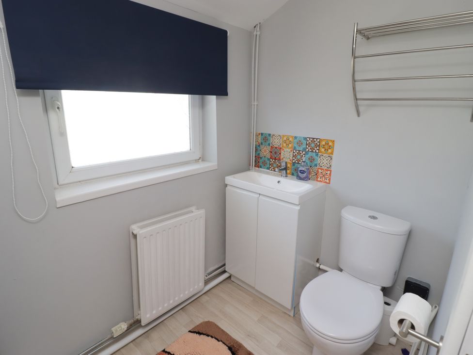 A bathroom with a sink and toilet at Farm Cottage 