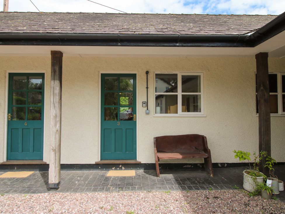 Entrance area with doors and a bench at Apartment 3 in Lydbury North