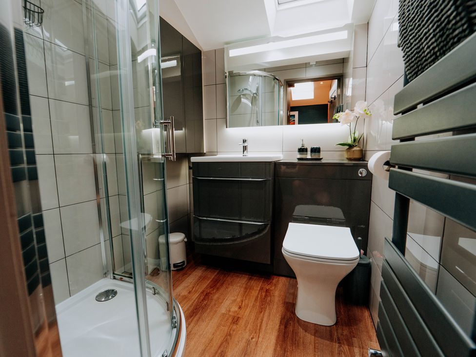 A bathroom with a shower and toilet at TyCosy in St Davids