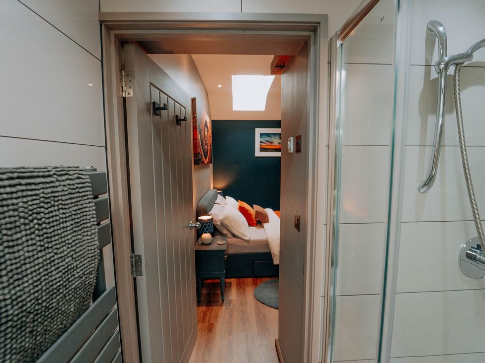 A view into a bedroom from a bathroom at TyCosy St Davids