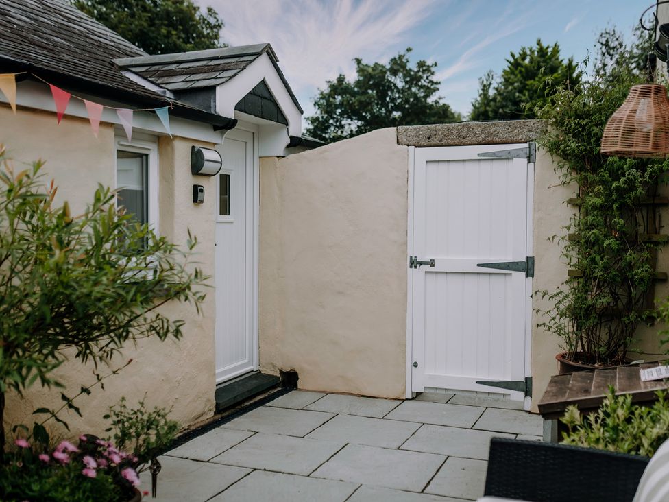 A garden area with a door and gate at TyCosy St Davids