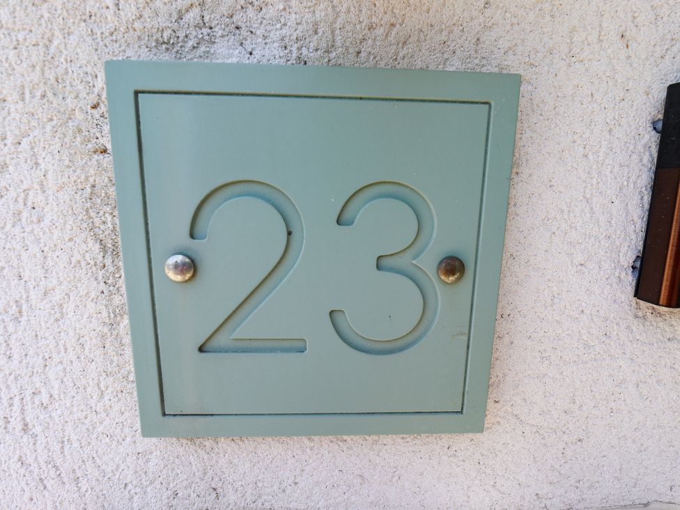 A house number sign displaying the number 23 at Burton Fields in Brandesburton