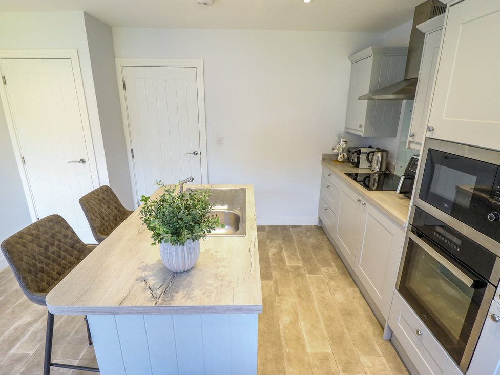 A kitchen with a sink and appliances at Burton Fields in Brandesburton