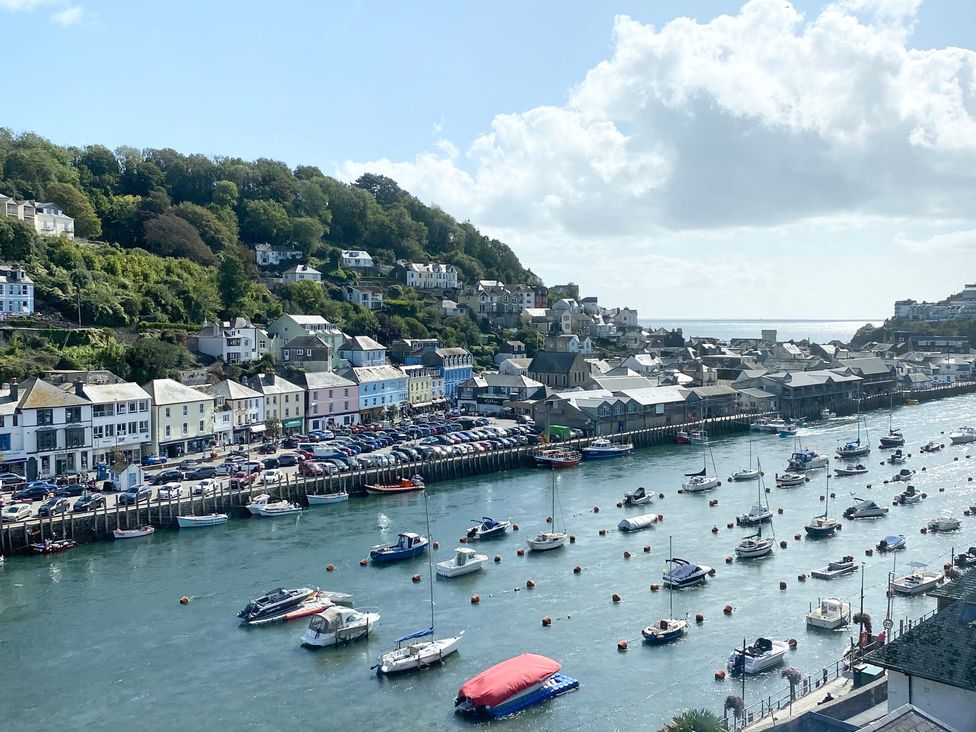 A harbor with boats and houses overlooking at Nesden House in 