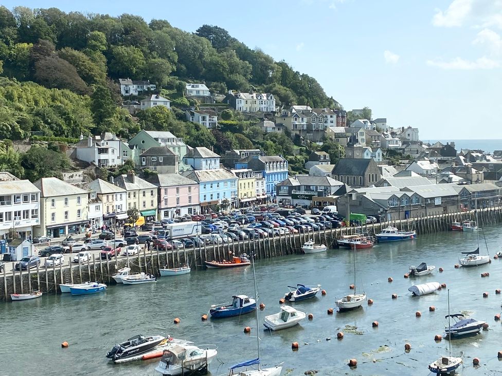 A harbor with boats and colorful houses at Nesden House 