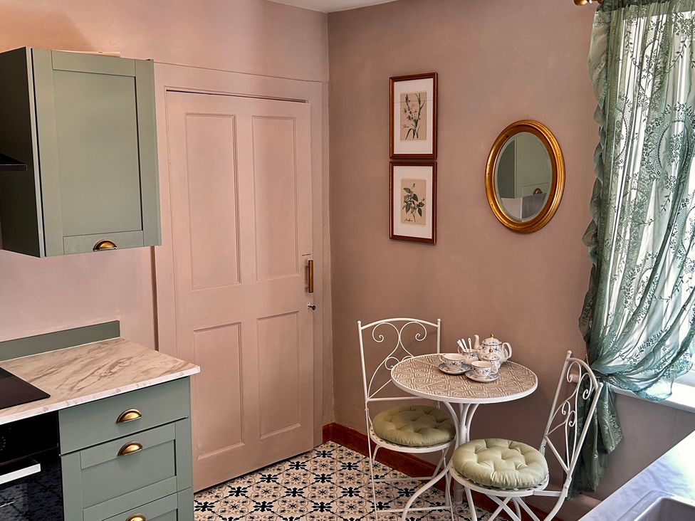A kitchen with a table and chairs at Downton II in Alnwick