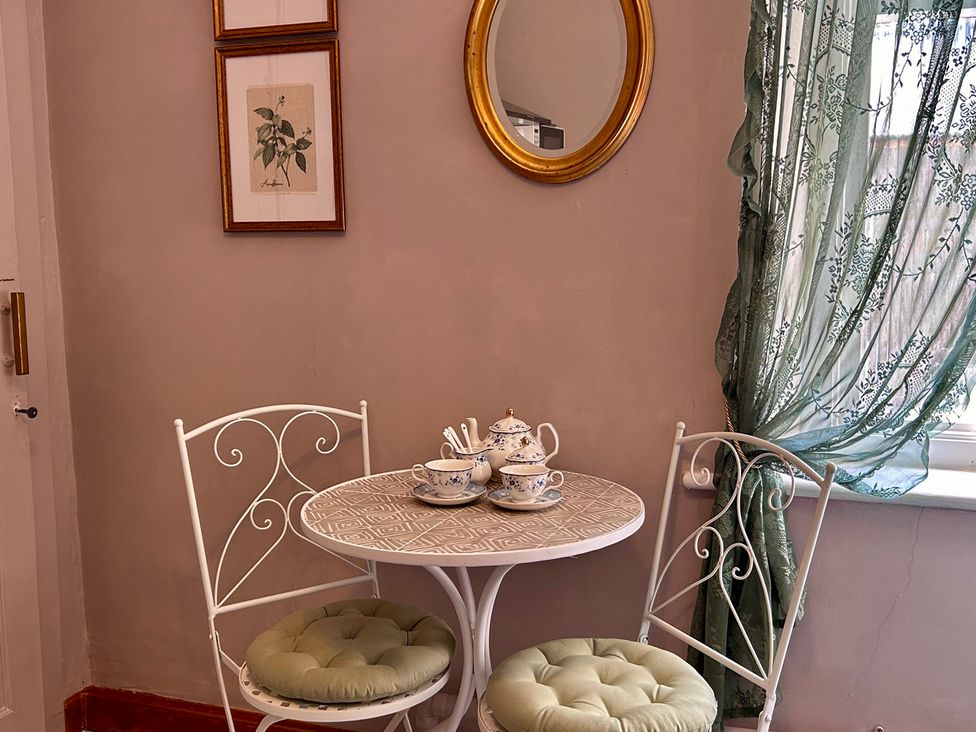 A dining room with a table and chairs at Downton II in Alnwick