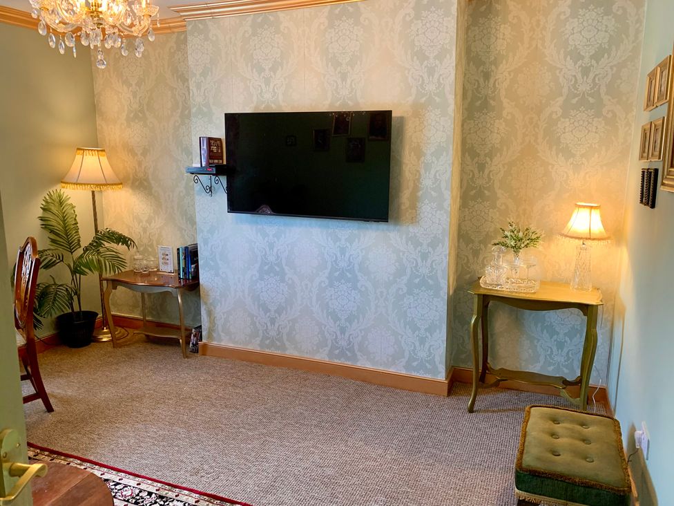 A living room with a television and lamp at Downton II in Alnwick