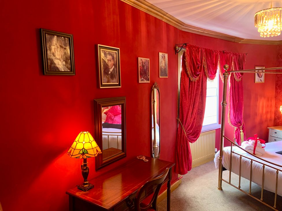 A bedroom with a bed and furniture at Downton II in Alnwick