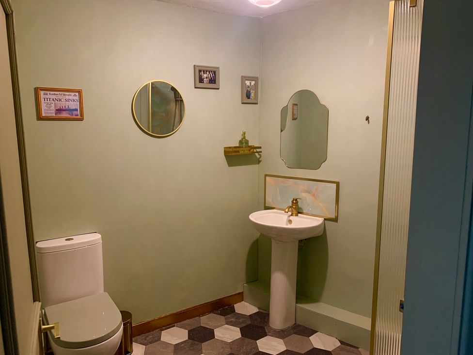 A bathroom with a toilet and sink at Downton II in Alnwick