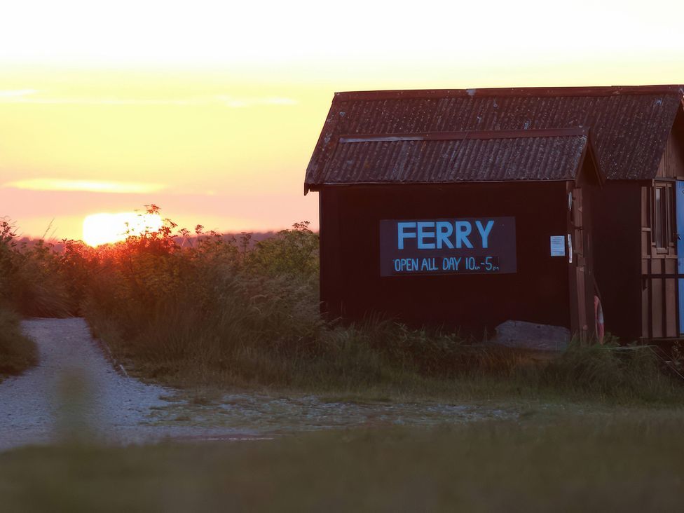 A ferry building with a sign and pathway at No 1 The Martins in Walberswick