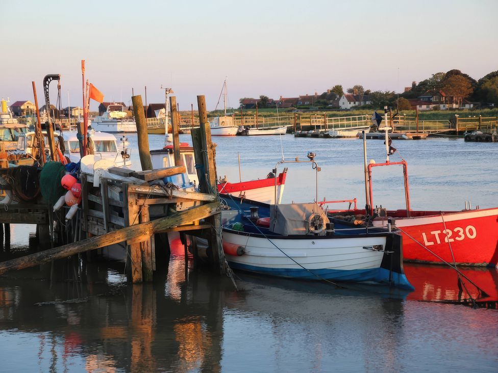 Boats by the dock on the water at No 1 The Martins Walberswick