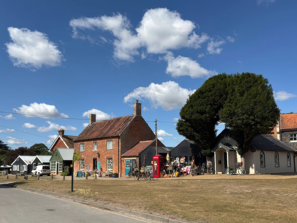 A street view with a house and bicycles at No 1 The Martins Walberswick